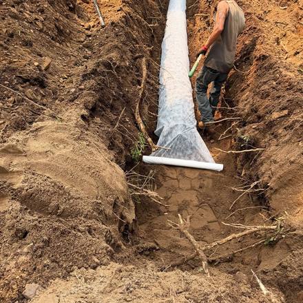 Septic field pipe laid through shale