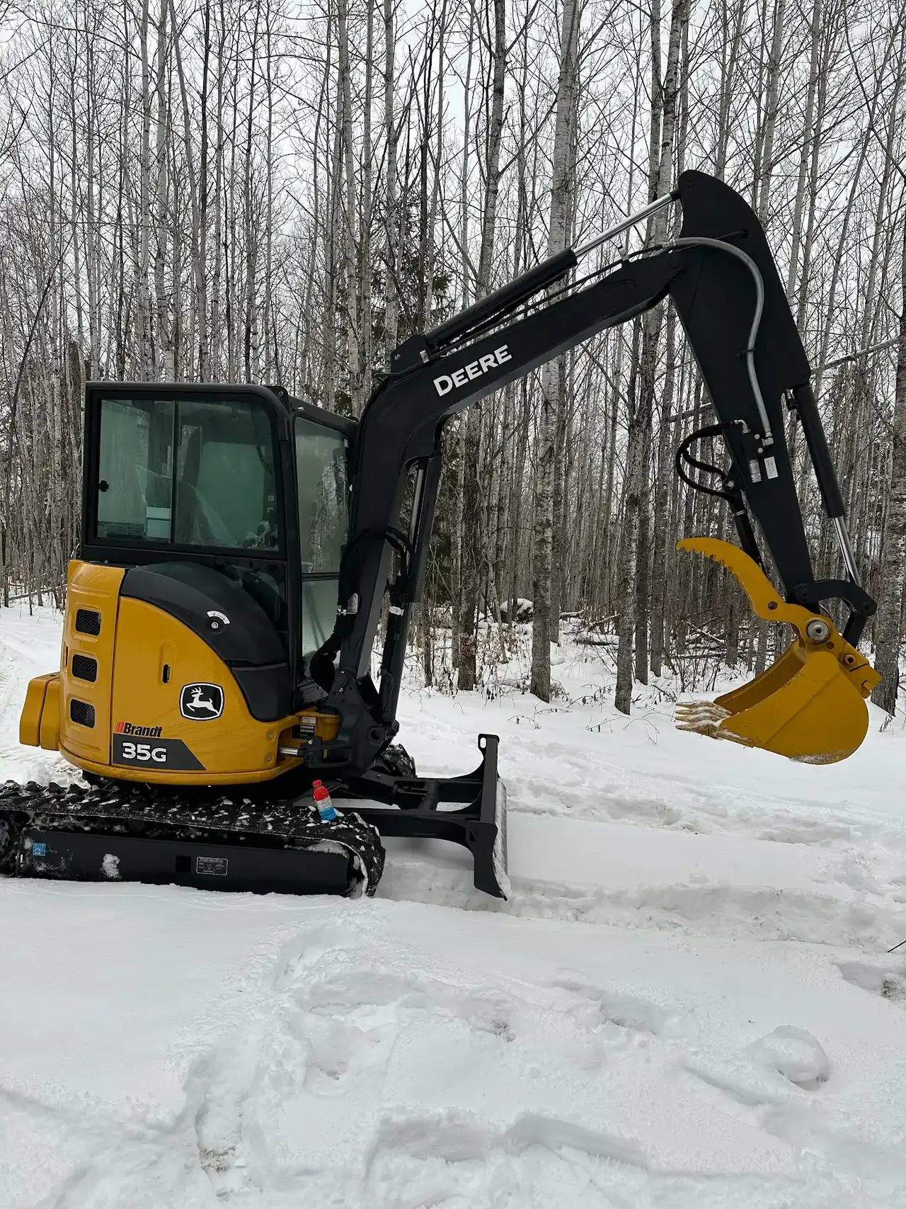 Our mini excavator, blade on for winter